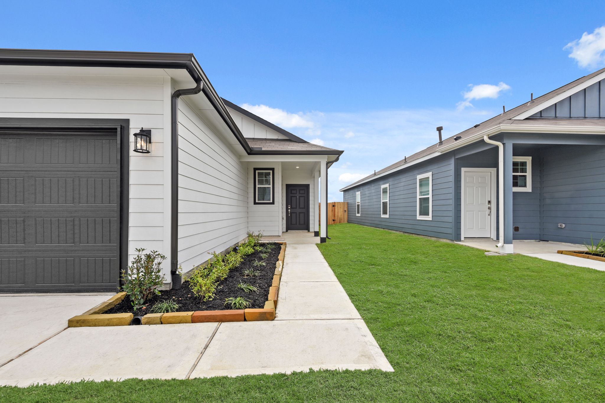 A house with a green lawn.