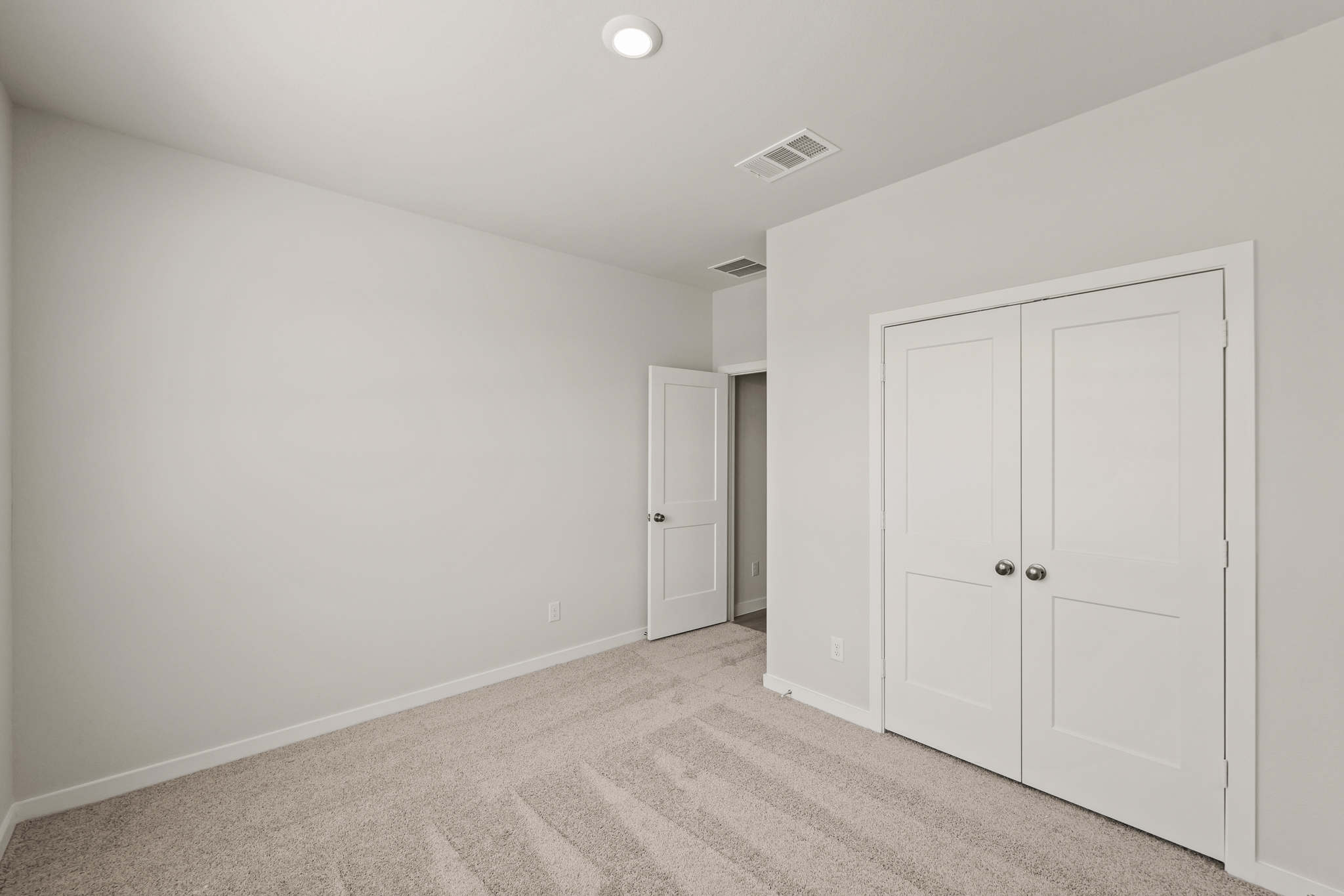 A room with white doors.