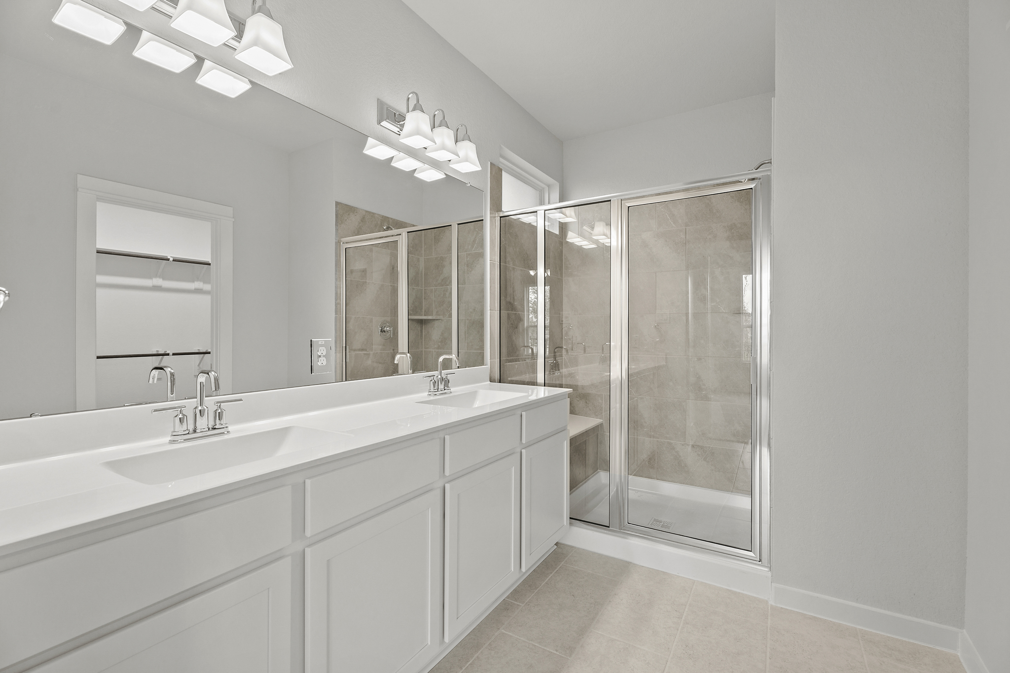A bathroom with a glass shower.