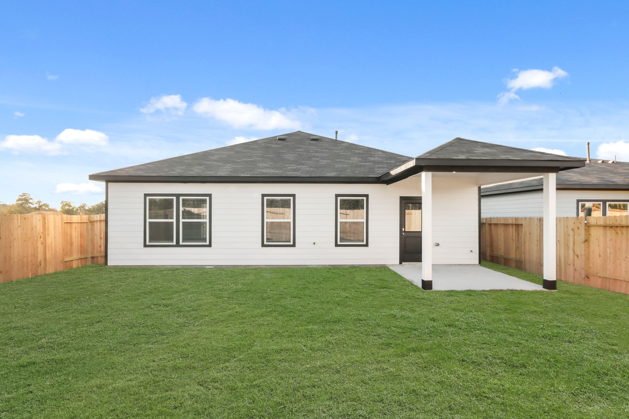 A house with a green lawn.