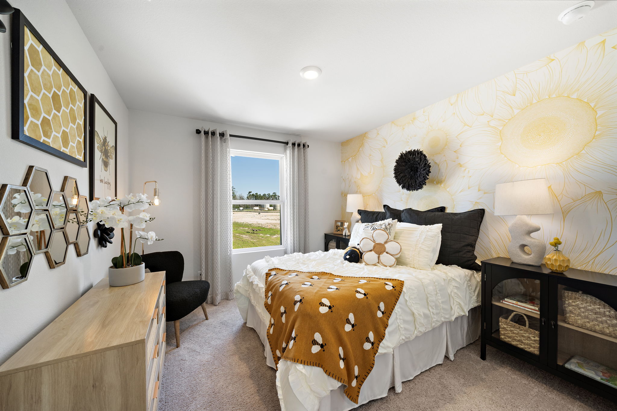 A bedroom with a large window.