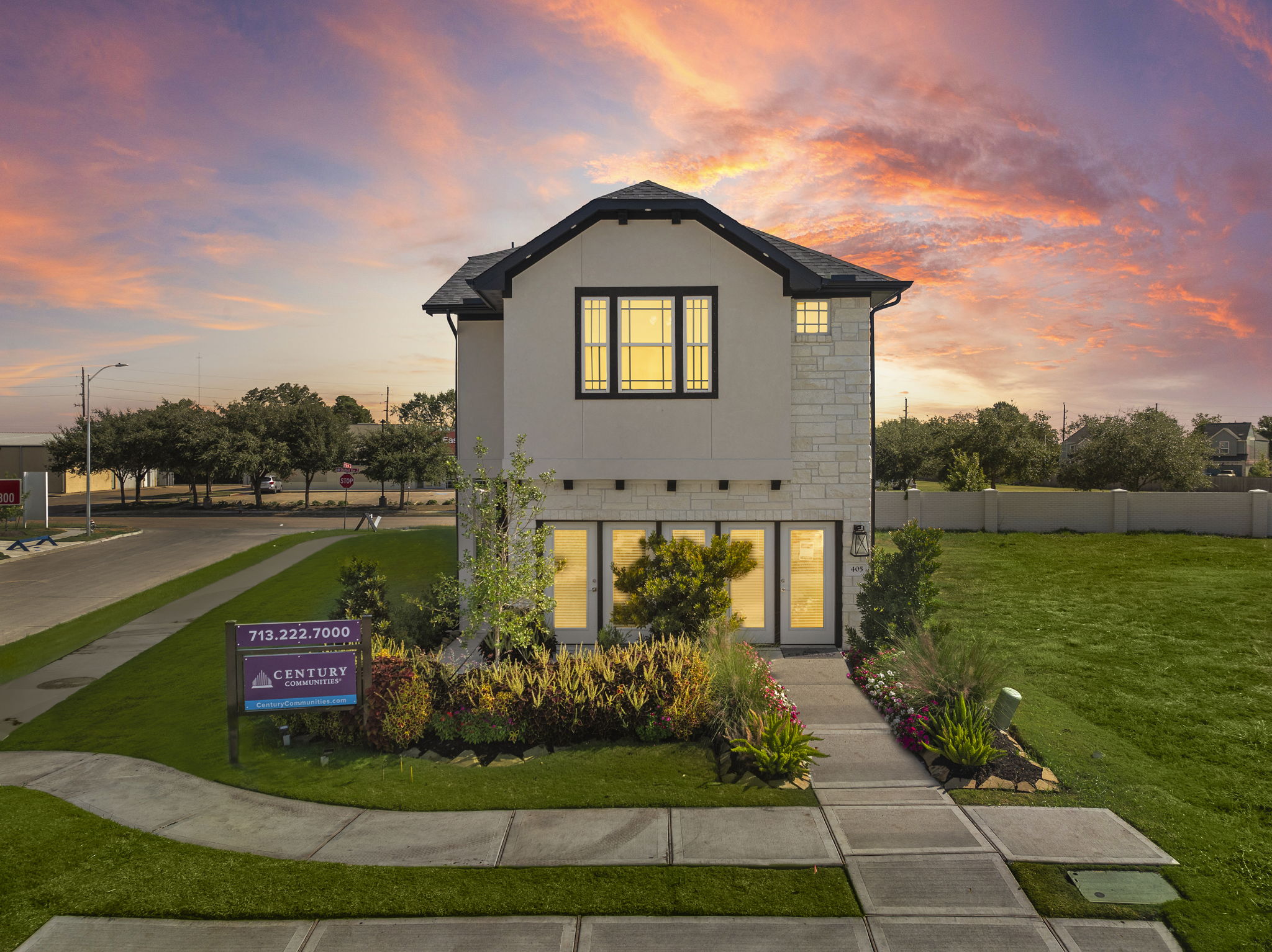 A small house with a driveway.