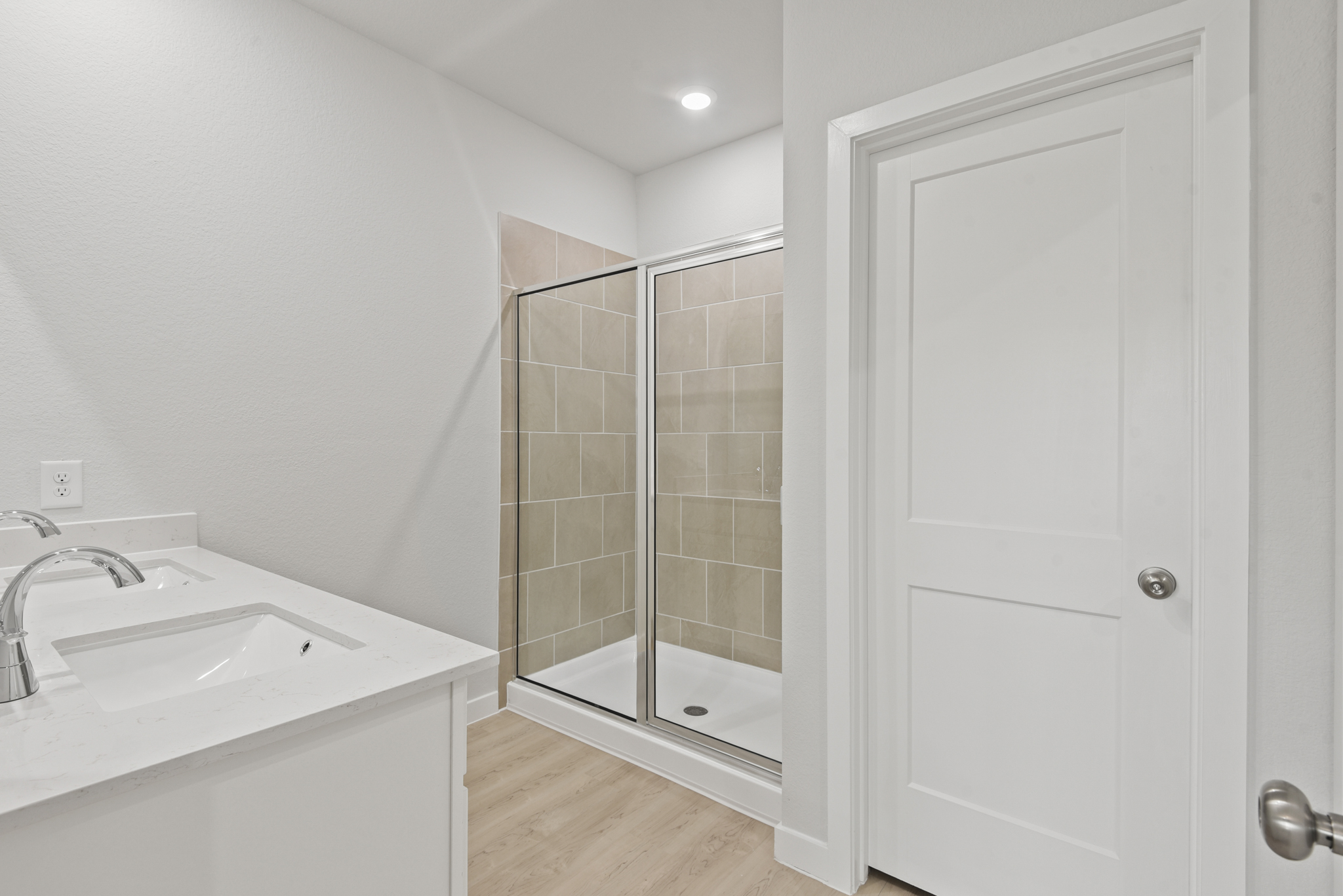 A bathroom with a glass shower.