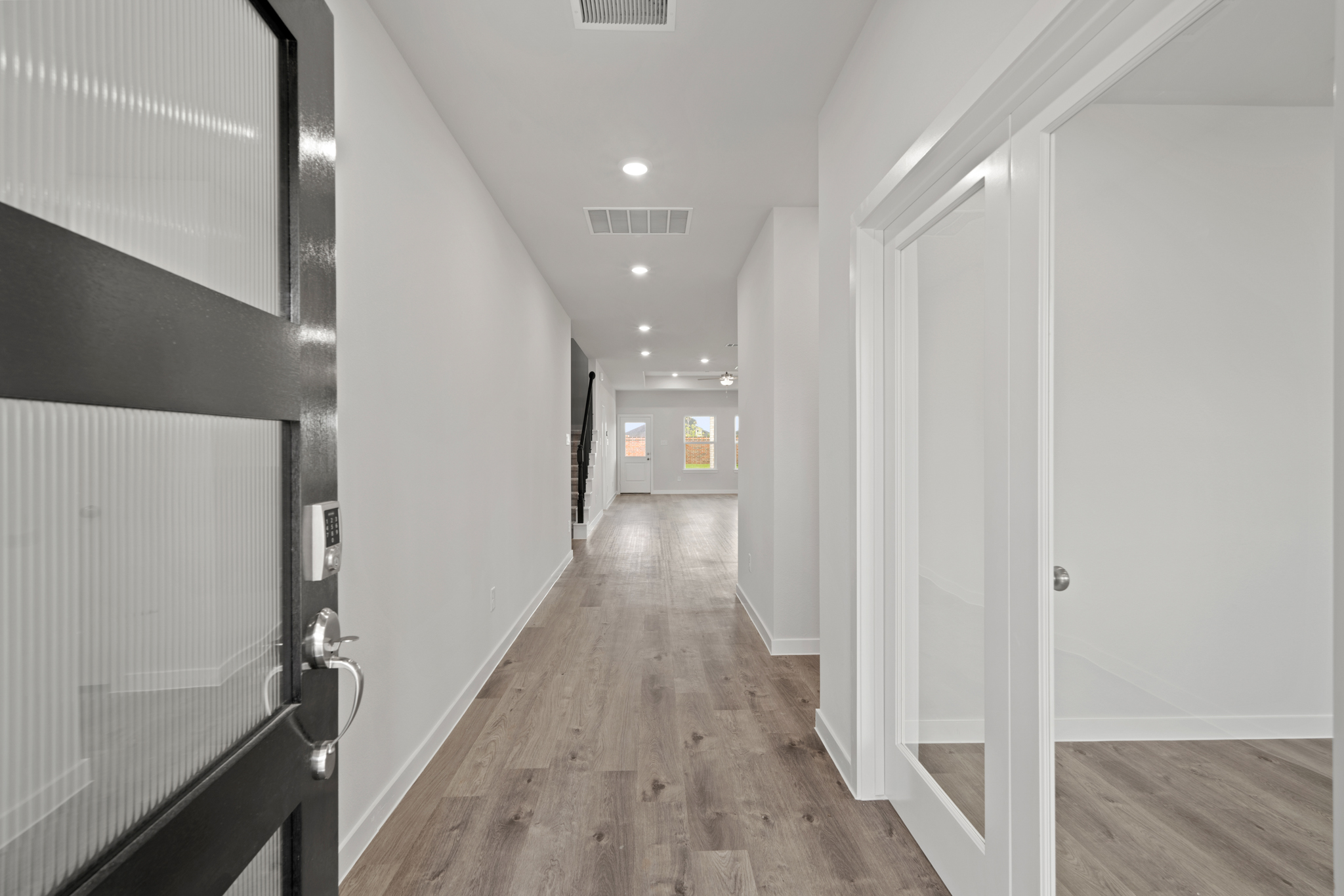 A hallway with white walls.
