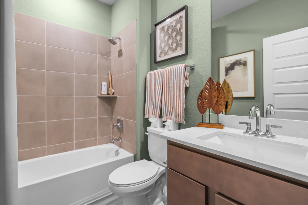 A bathroom with a toilet and sink.