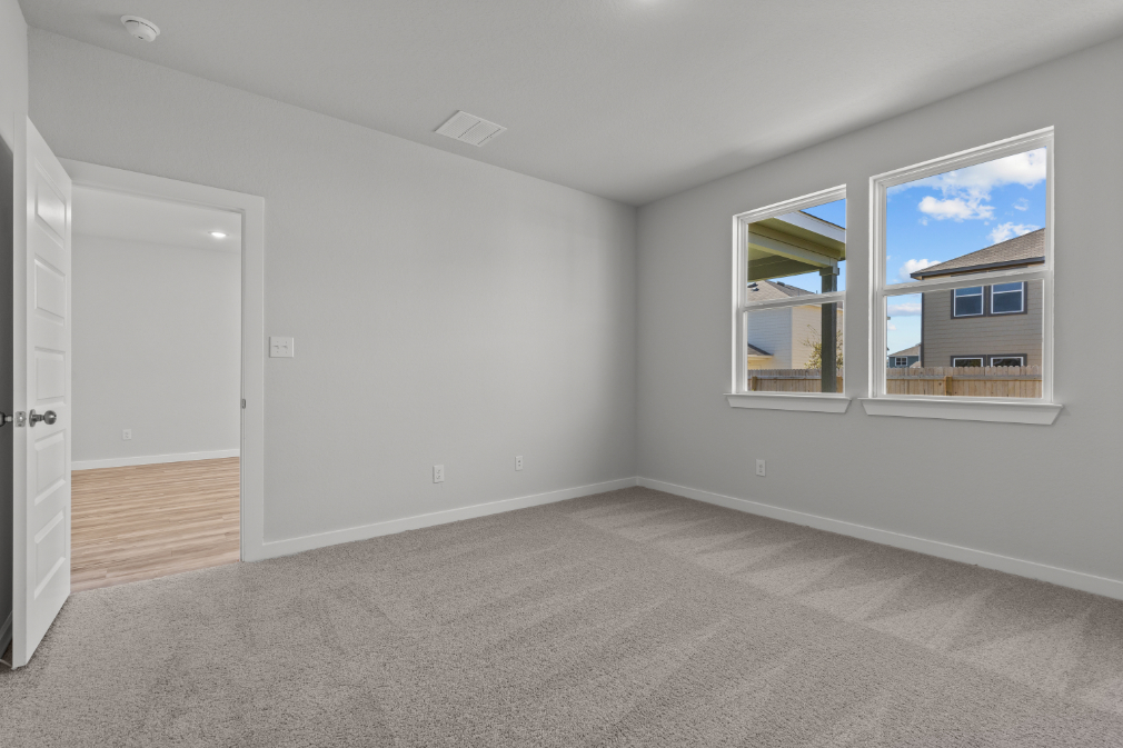 A room with a window and a door.