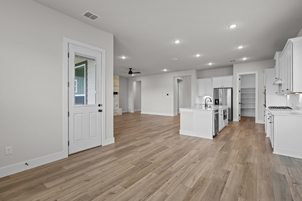 A large kitchen with white cabinets.