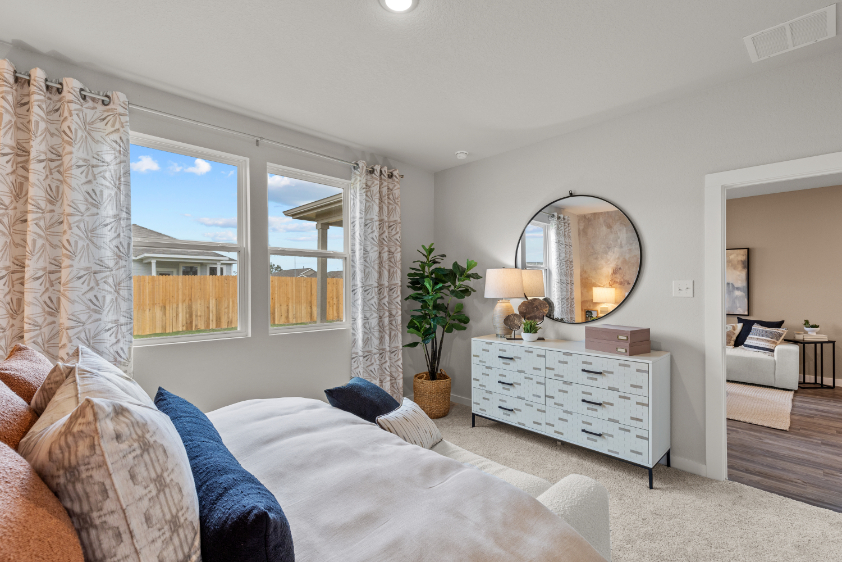 A living room with a large mirror.