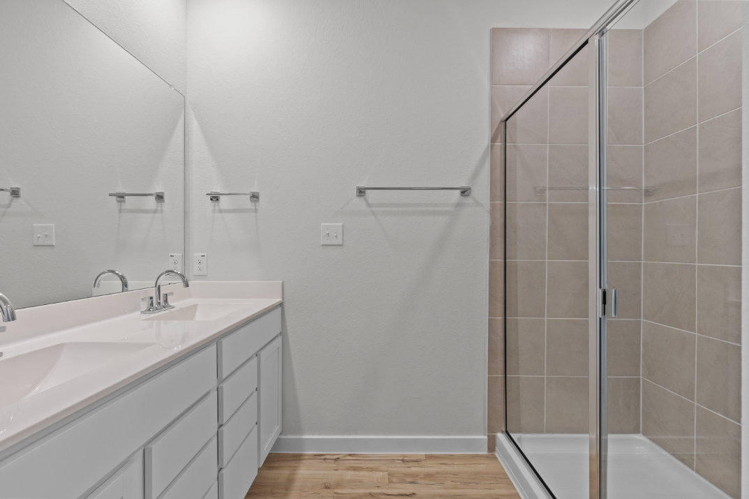 A bathroom with a glass shower.