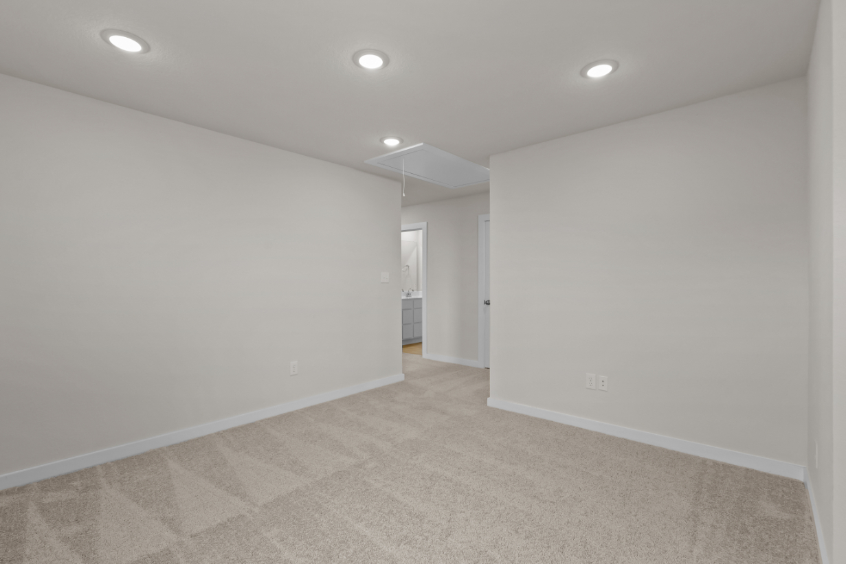 A hallway with white walls.