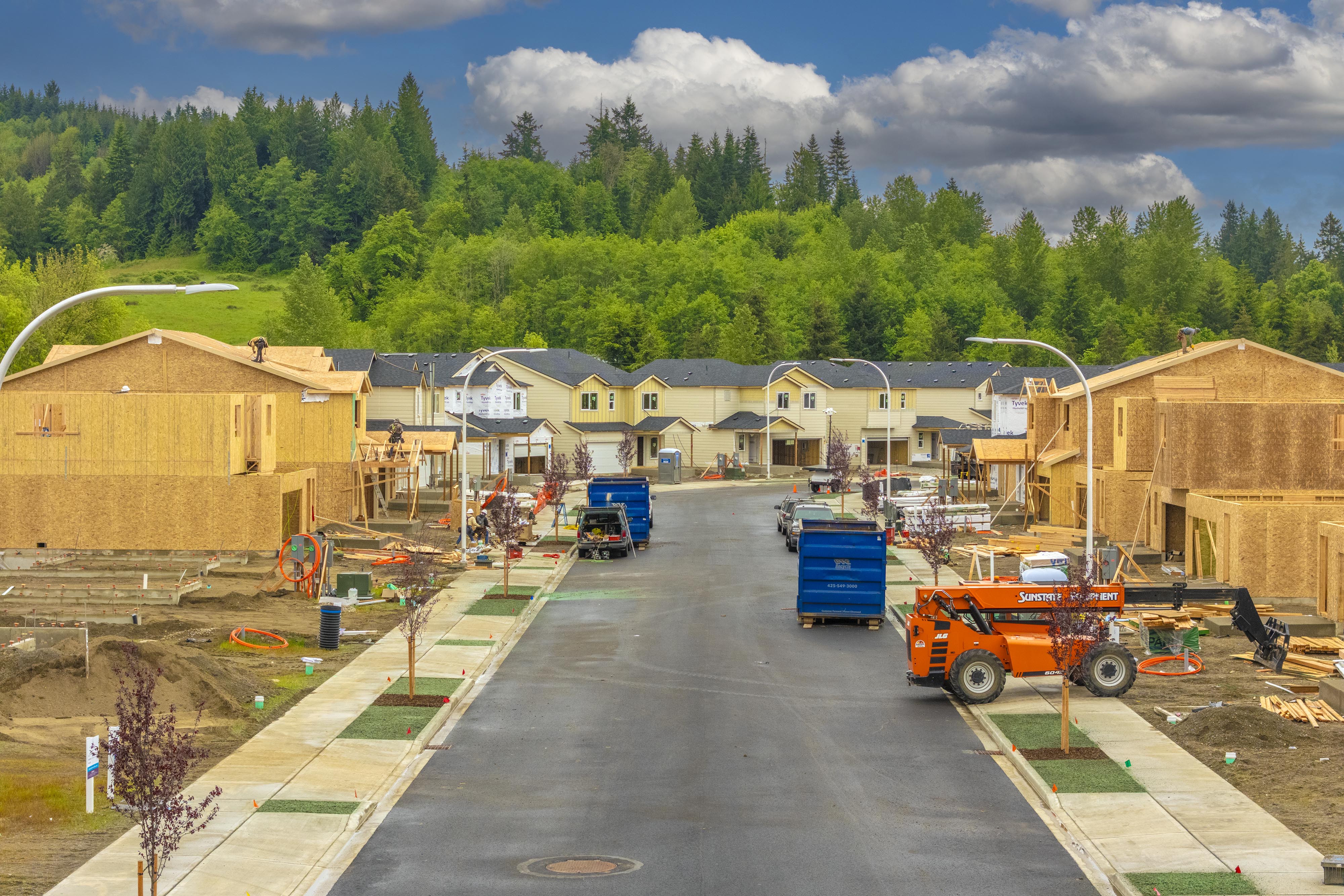 A construction site with a few trucks.