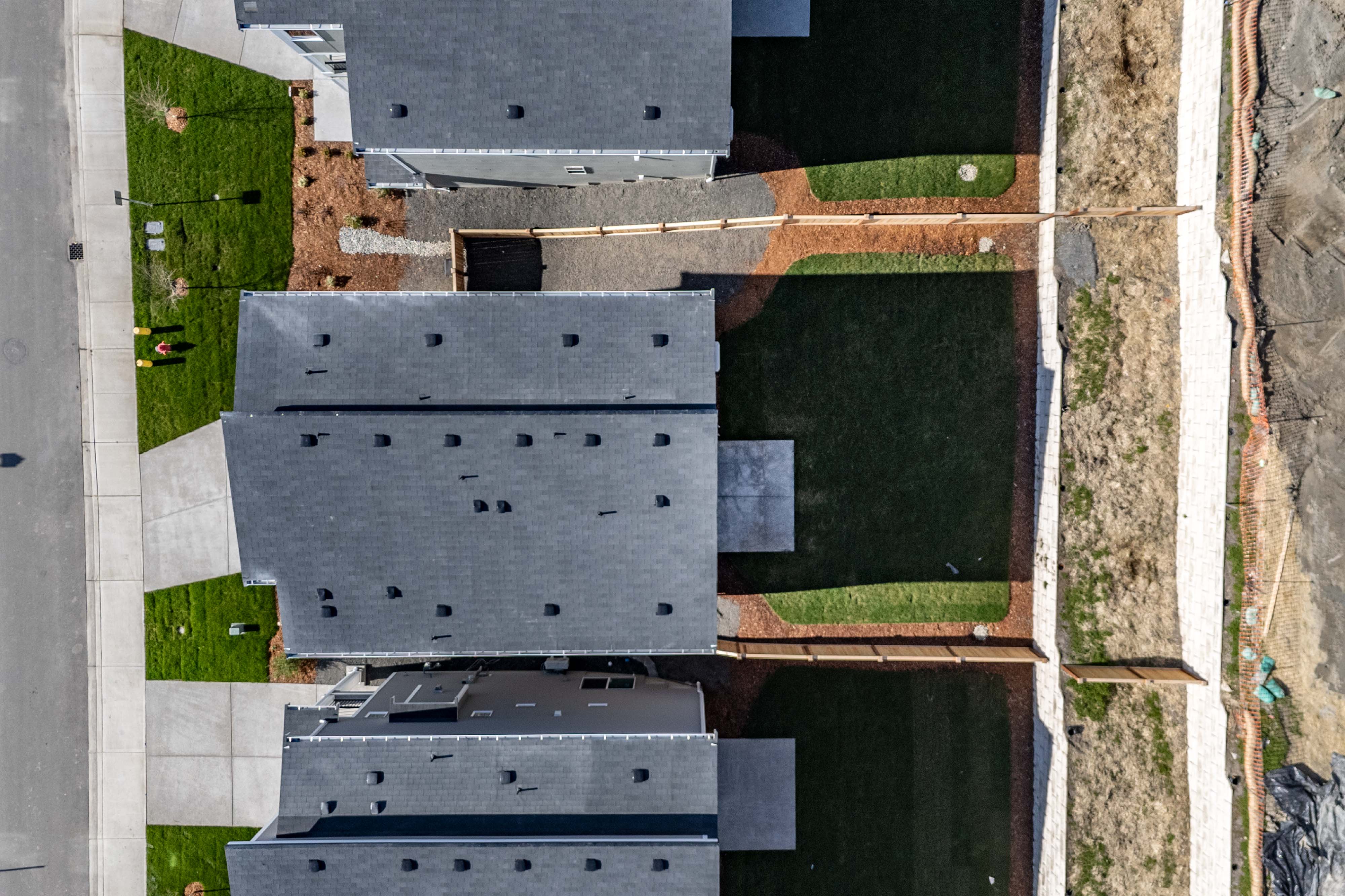 A building with a green lawn.