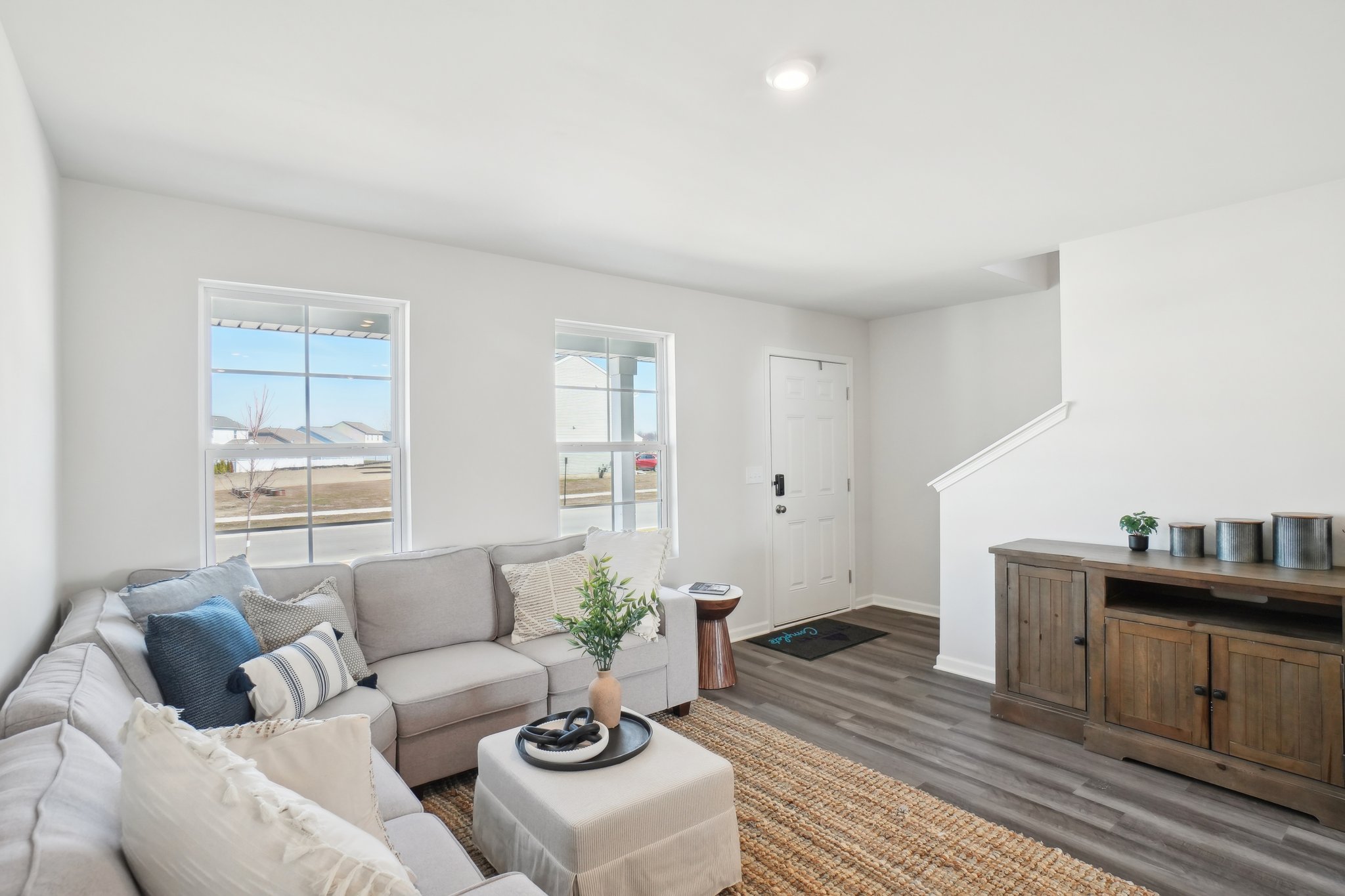 A living room with a couch and a table.