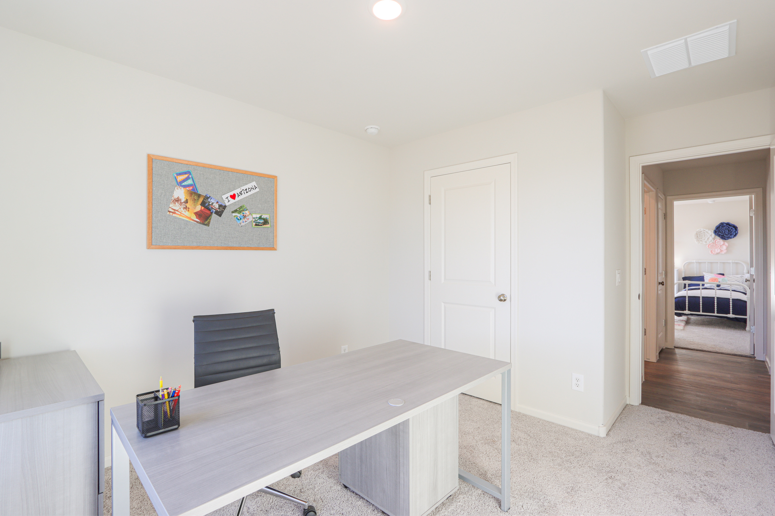 A room with a table and a door.