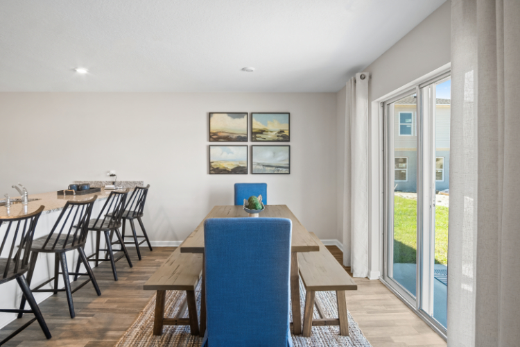 A room with tables and chairs.