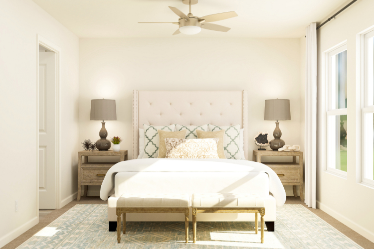 A bedroom with a bed and lamps.