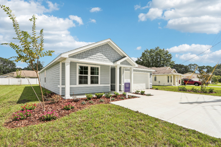 A white house with a driveway.