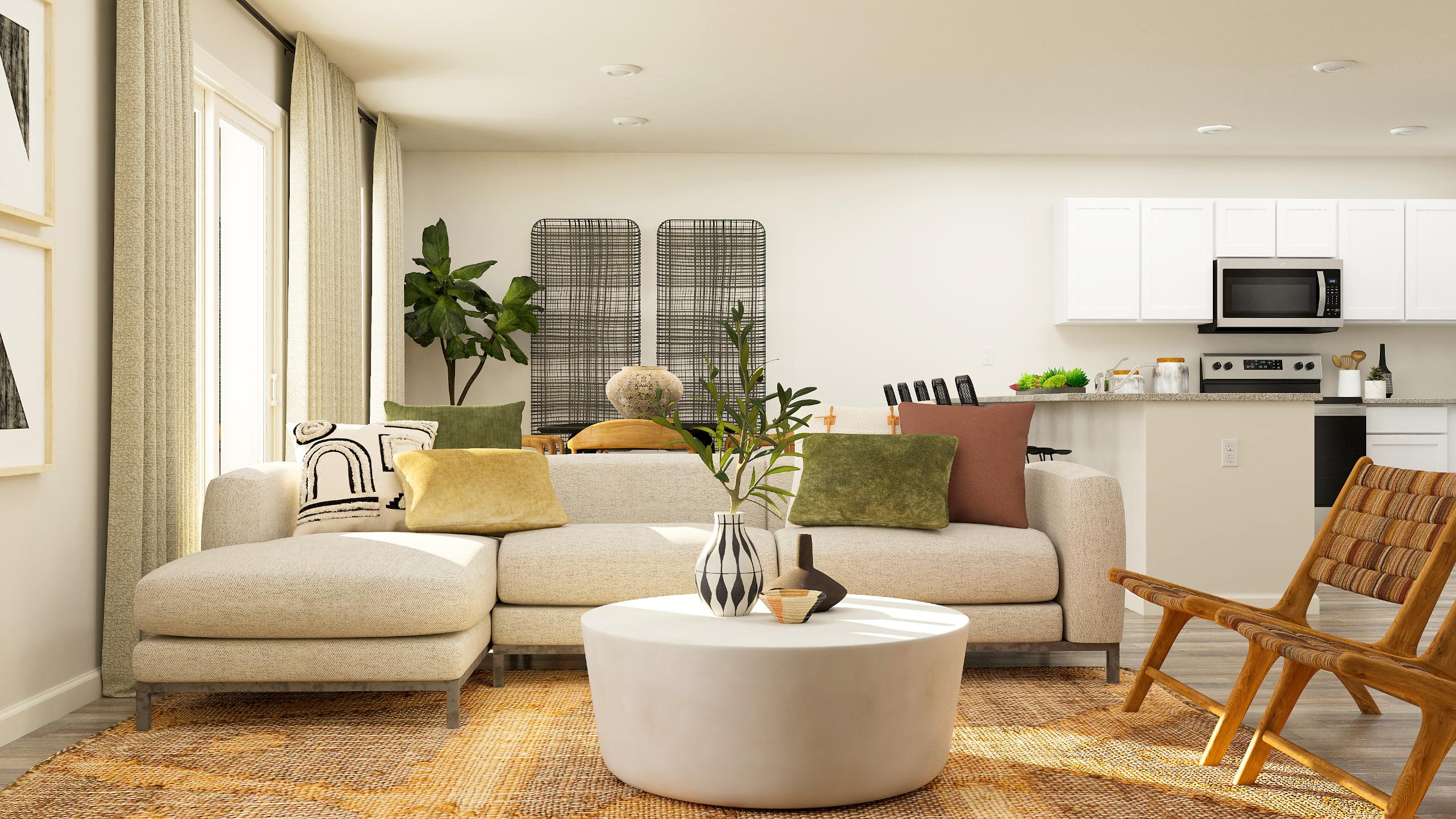 A living room with a white couch and a table.
