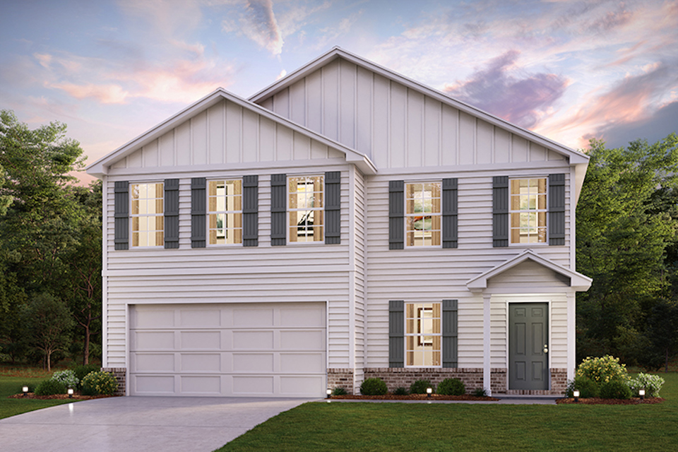 A white house with a garage.