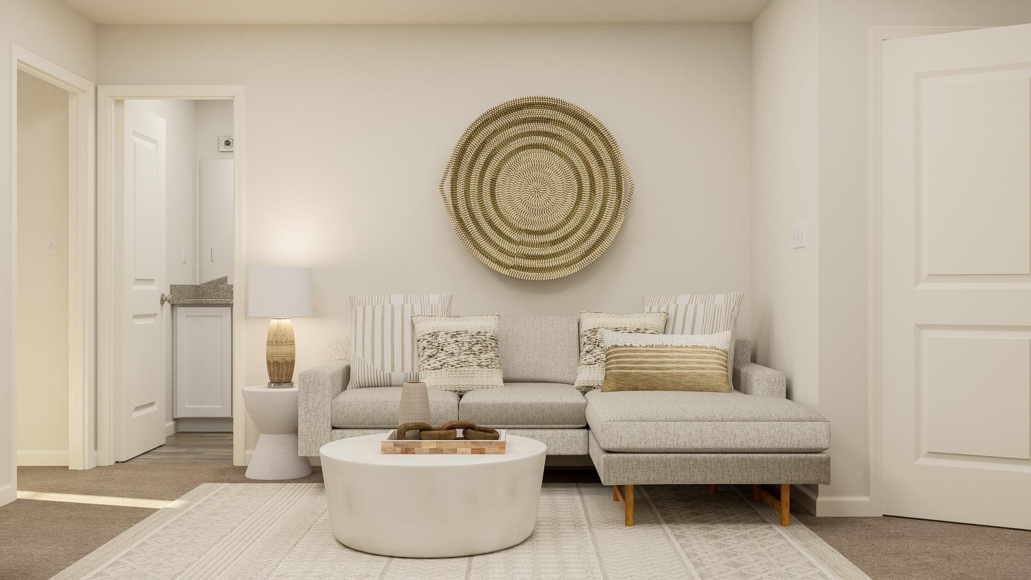 A living room with a white wall.