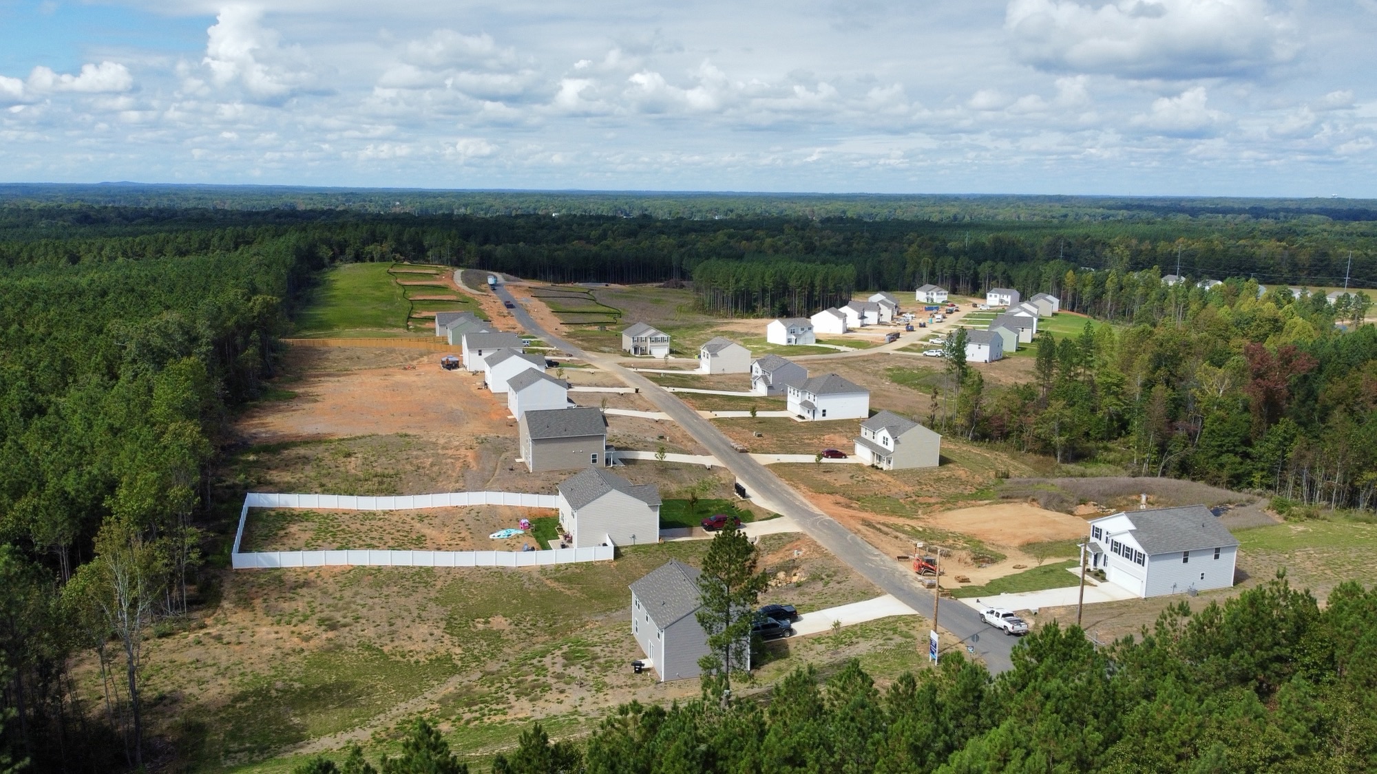 A group of buildings in a field.