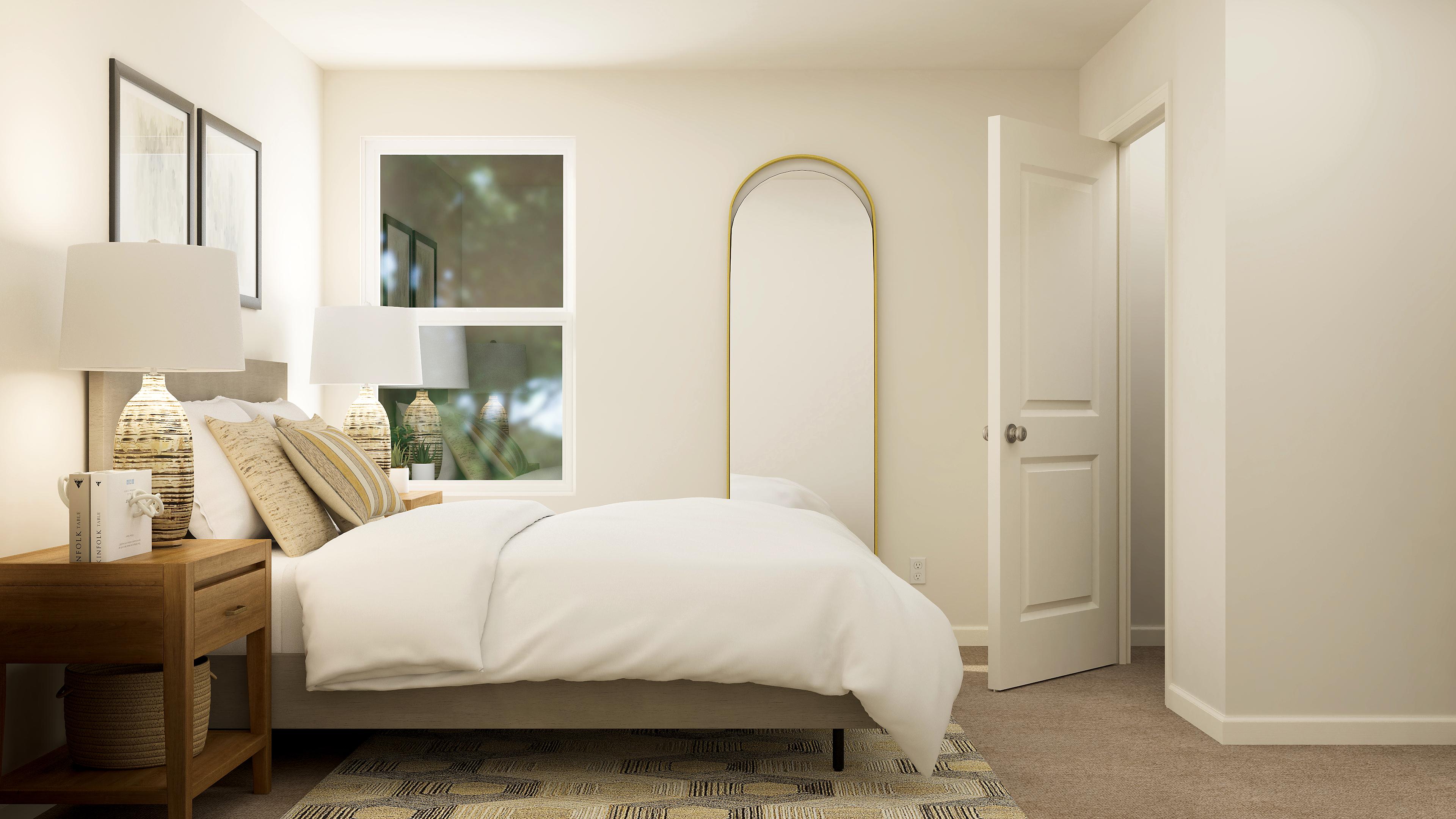 A bedroom with a bed and lamps.